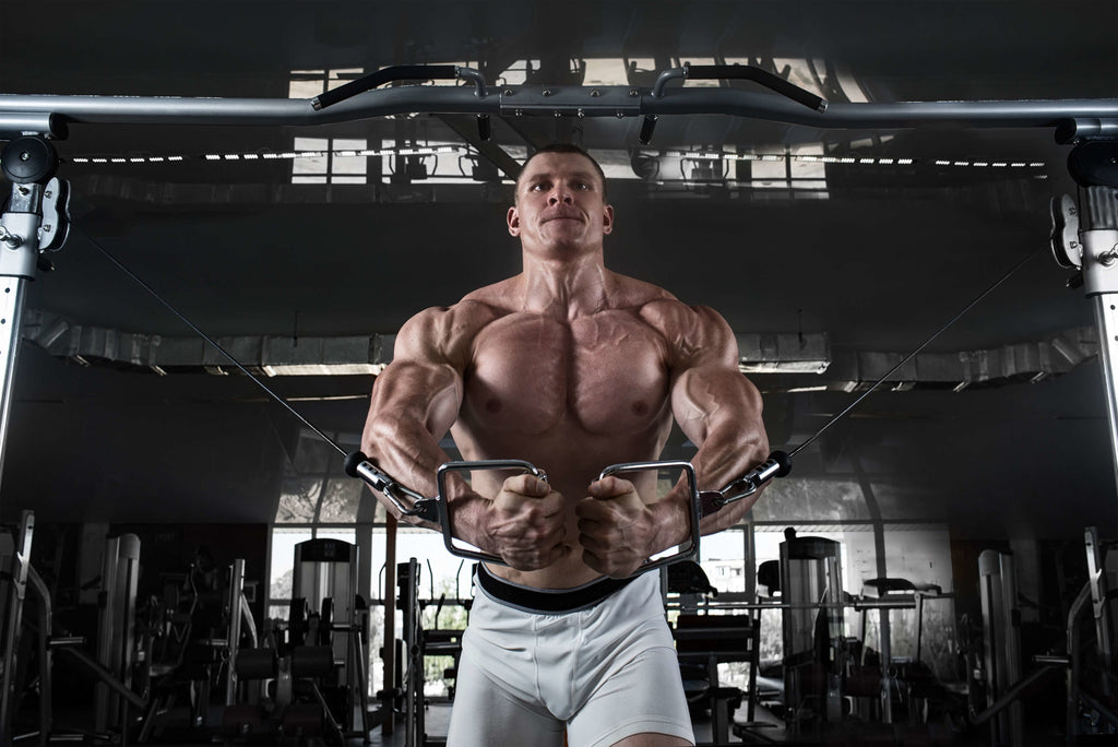 man in gym building body mass