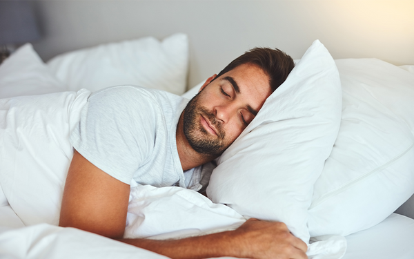 Man sleeping to improve belly fat loss