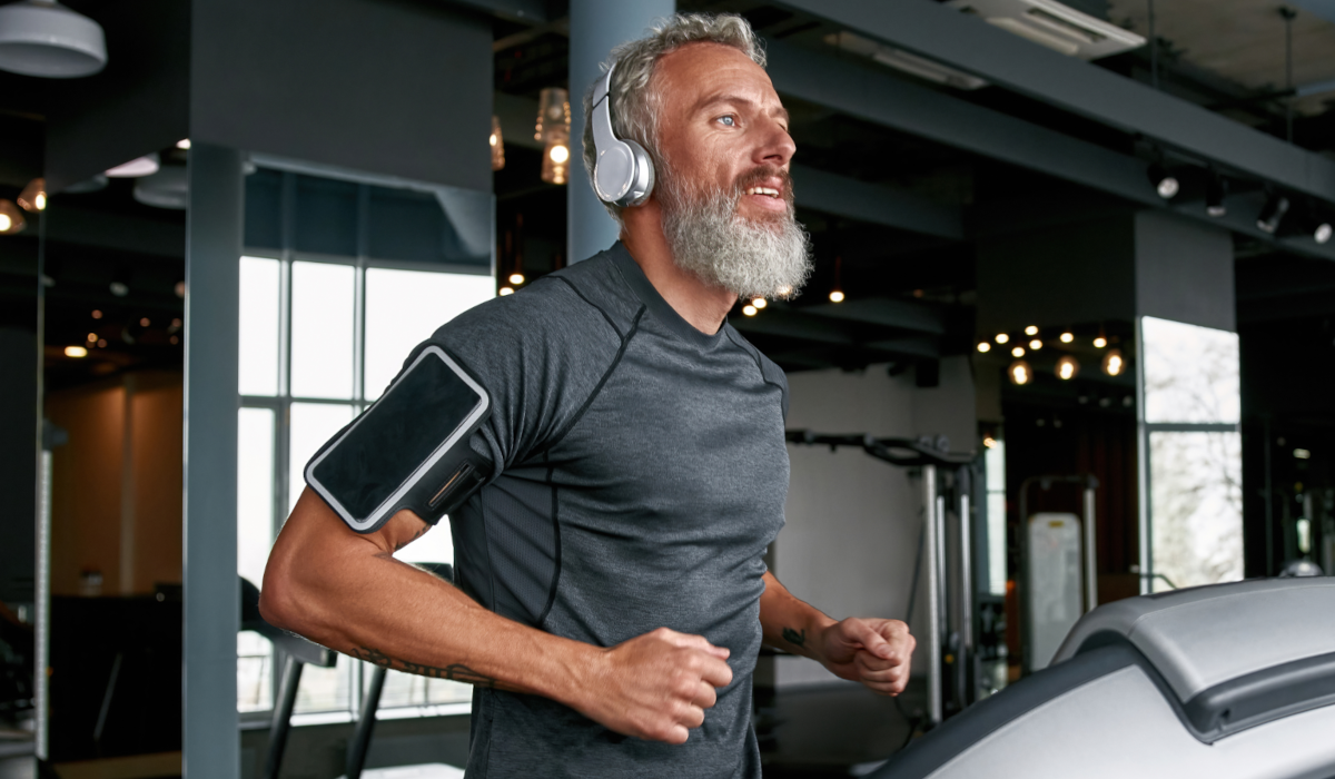 man running wearing headphones