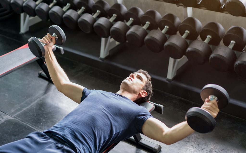 Man doing dumbbell flyes