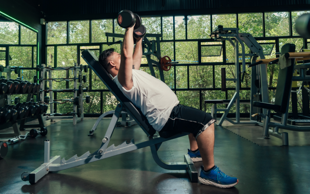 Man exercising to lose man boobs