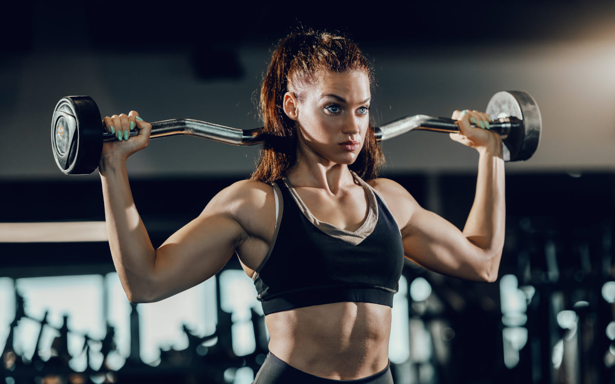 Female bodybuilder lifting weights