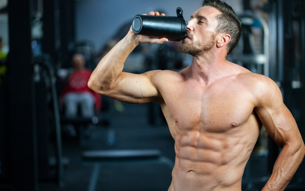 Bodybuilder drinking pre-workout