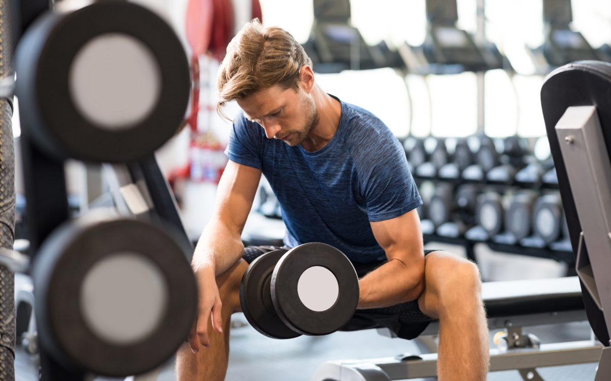 Strong man lifts weights