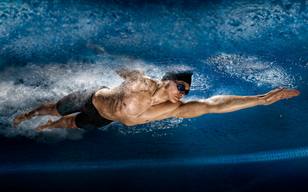 Bodybuilder swimming