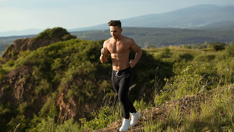 muscular man running outside