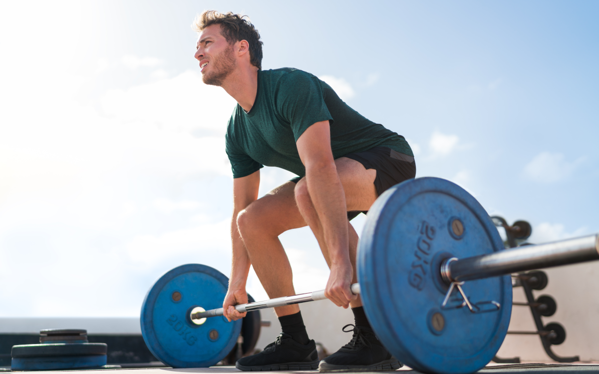 Man doing barbell squats