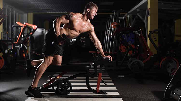 man does workout to build muscle