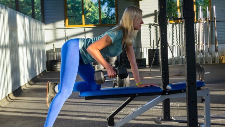 woman doing bent over rows