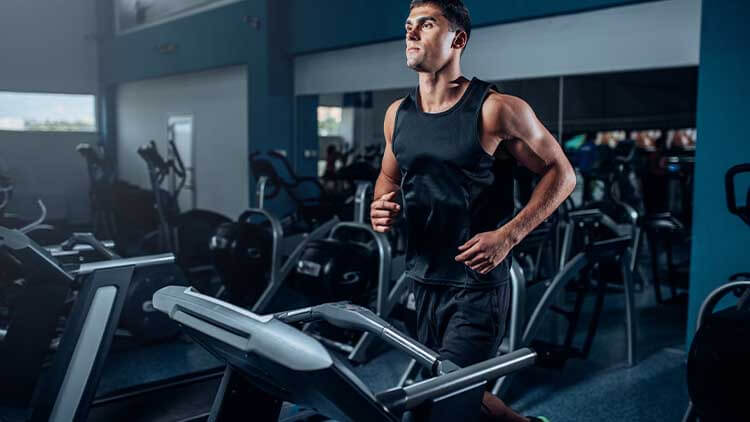 man running on treadmill to lose man boobs