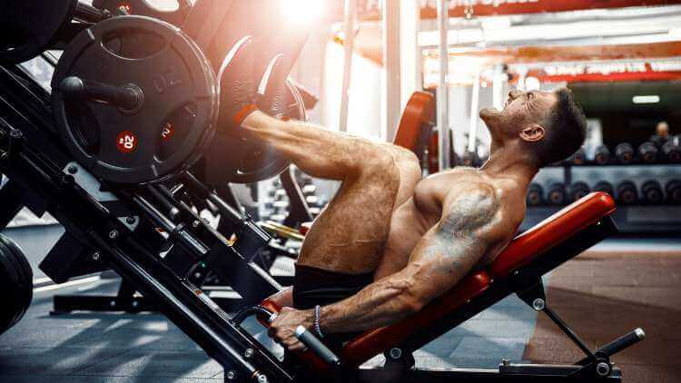 bodybuilder doing leg presses