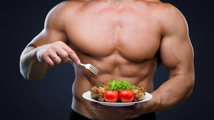 bodybuilder eating healthy food