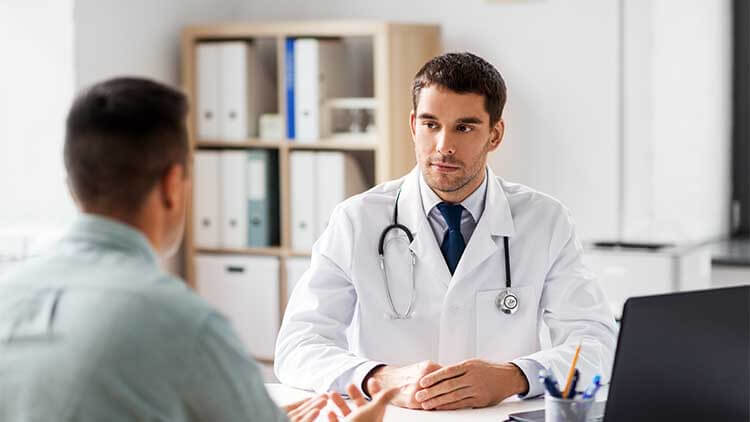 patient speaks to doctor about gynecomastia