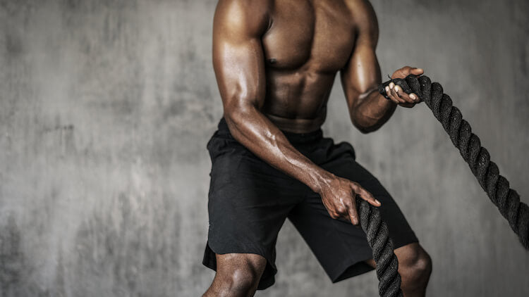 man doing ropes cardio exercise