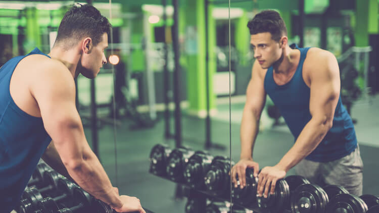 man prepares mentally to lift weights