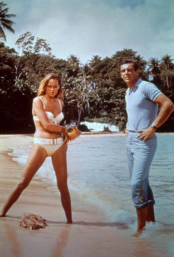 Ursula Andress as Honey Ryder and Sean Connery as James Bond on location in Jamaica(© 1962 Metro-Goldwyn-Mayer Studios Inc. and Danjaq, LLC.) 