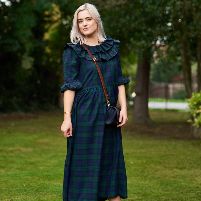 Striking blue and green tartan dress, with a wide double frill neckline, has a fitted waist and statement frilled edge sleeves.  The dress is an easy-to-wear statement piece, that is handmade to order in Minkie London's Camden studio.  The tartan dress comes in four sizes, designed to accommodate UK 6 -18