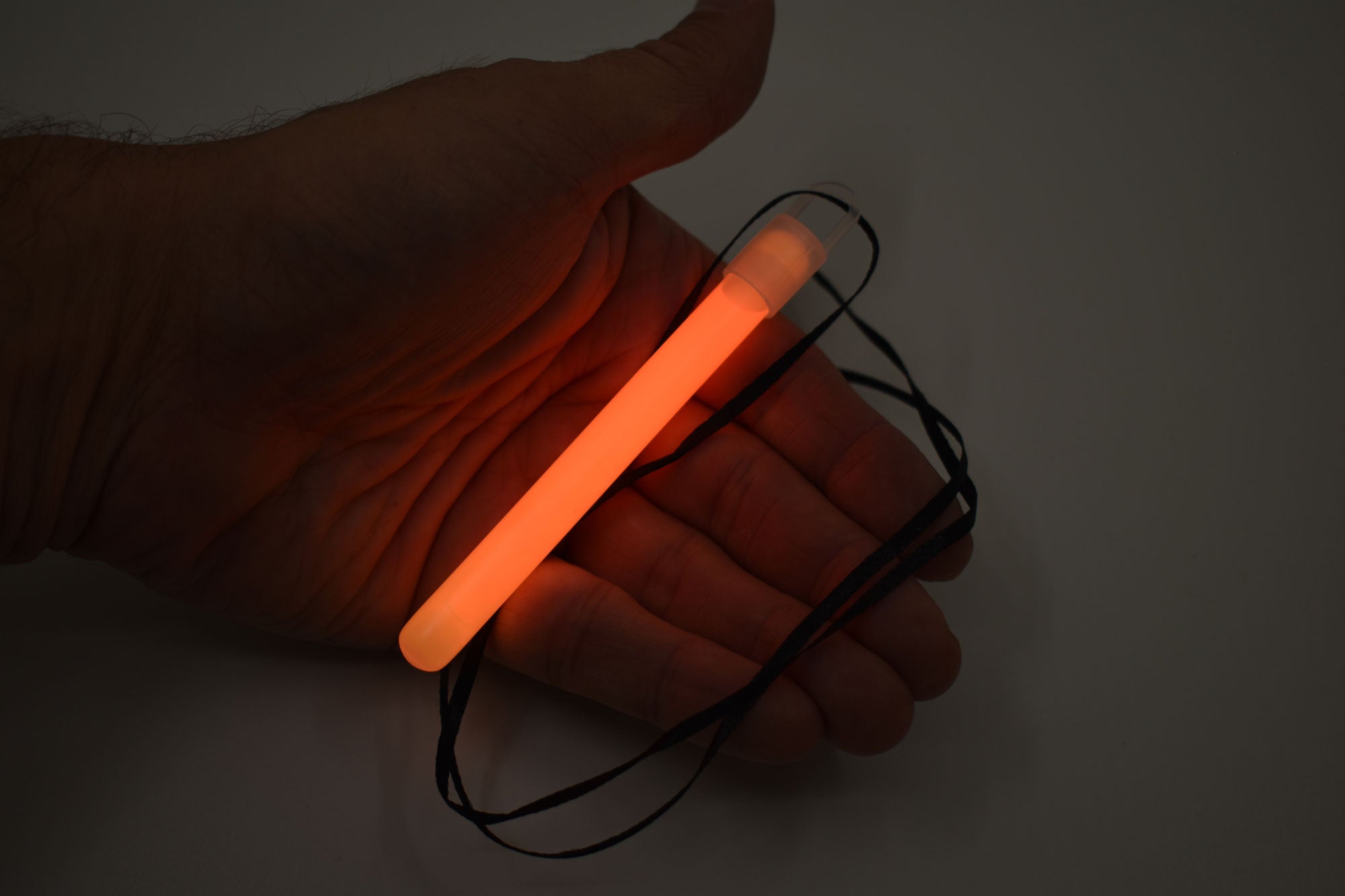 6 Inch Slim Orange Glow Sticks With Lanyards - Pack of 12