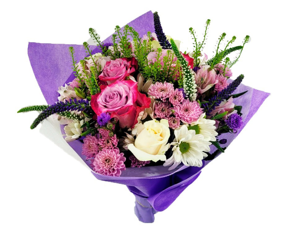 A breathtaking flower bouquet featuring bicolor lavender and cream roses, white alstroemeria, lilac chrysanthemums and purple veronicas, accented with soft touches of foliage.