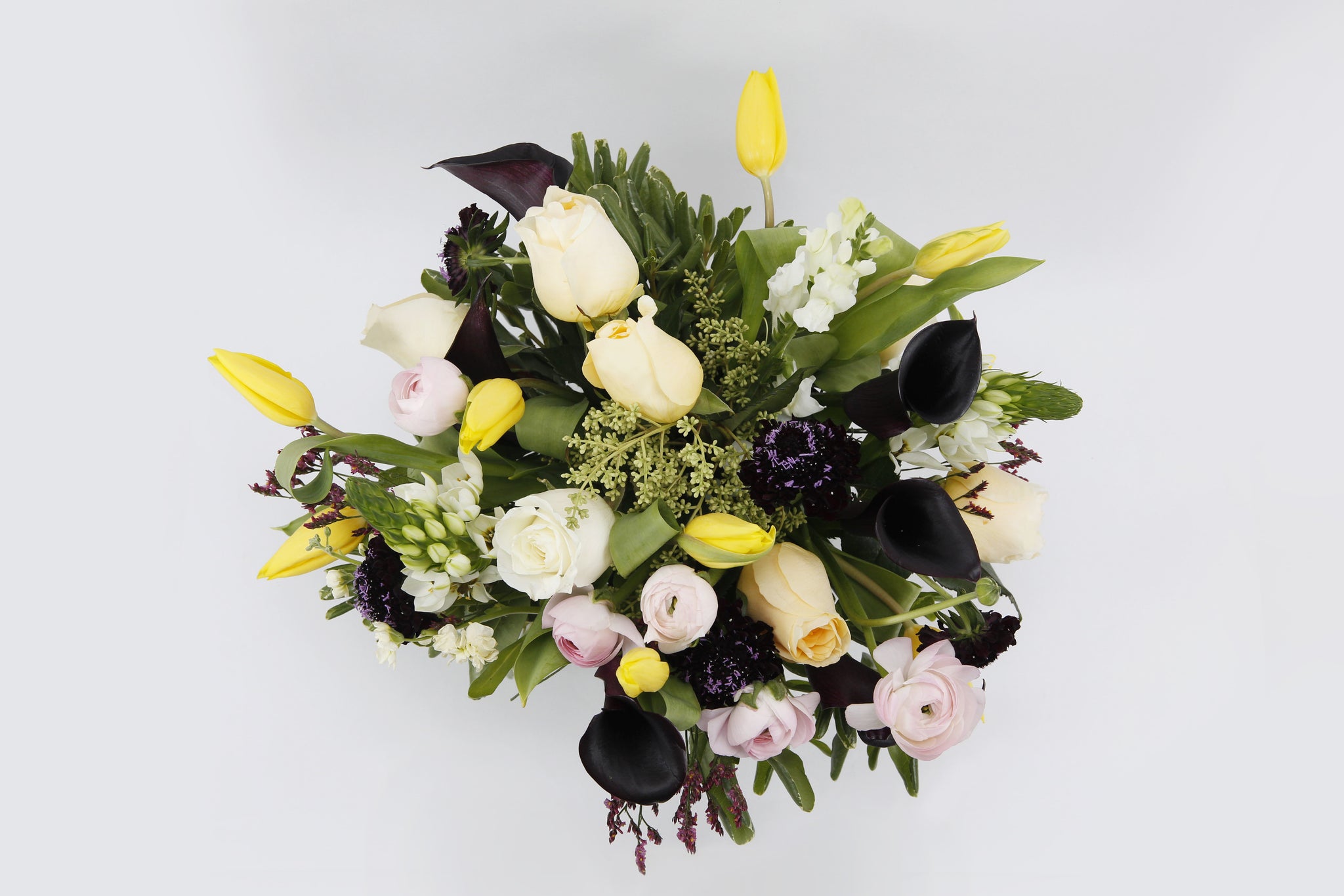 Share My World Bouquet Top - peach roses , yellow tulips , black callas , peach ranunculus , pink ranunculus, black scabiosa , heather , white snapdragons , white Ornithogalum , vase arrangement