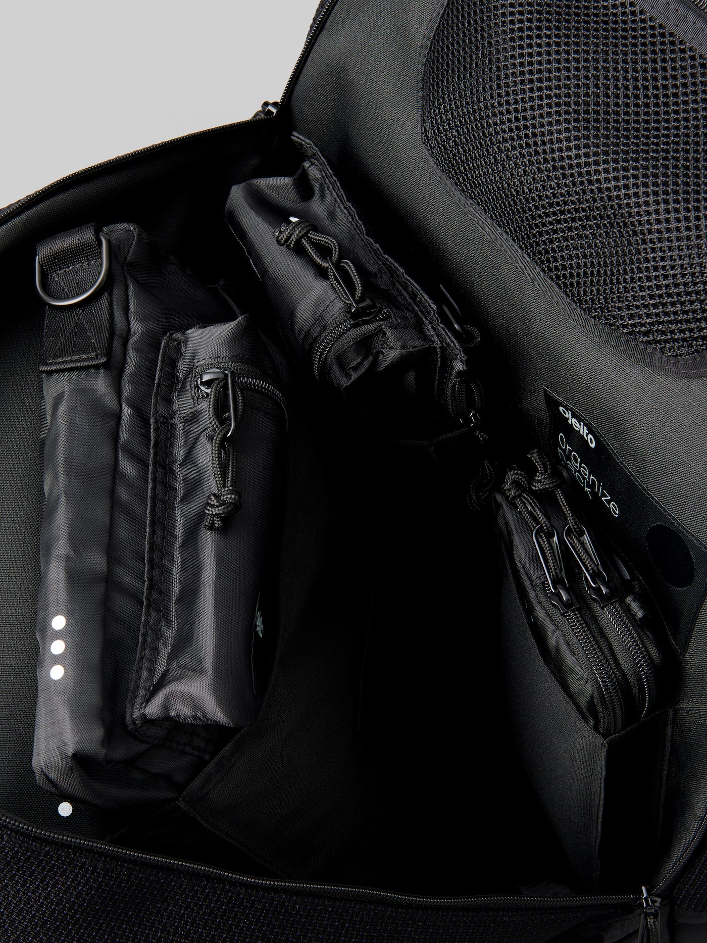 interior shot of packed ojeito backpack go-kit in black