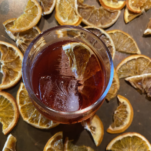 negroni cocktail taken top down with ice and orange slice