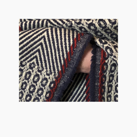 detailed picture of red selvedge detail on our poncho Belmonte