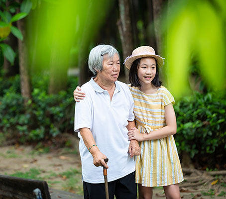image of child helping elderly lady with Alzheimer's disease