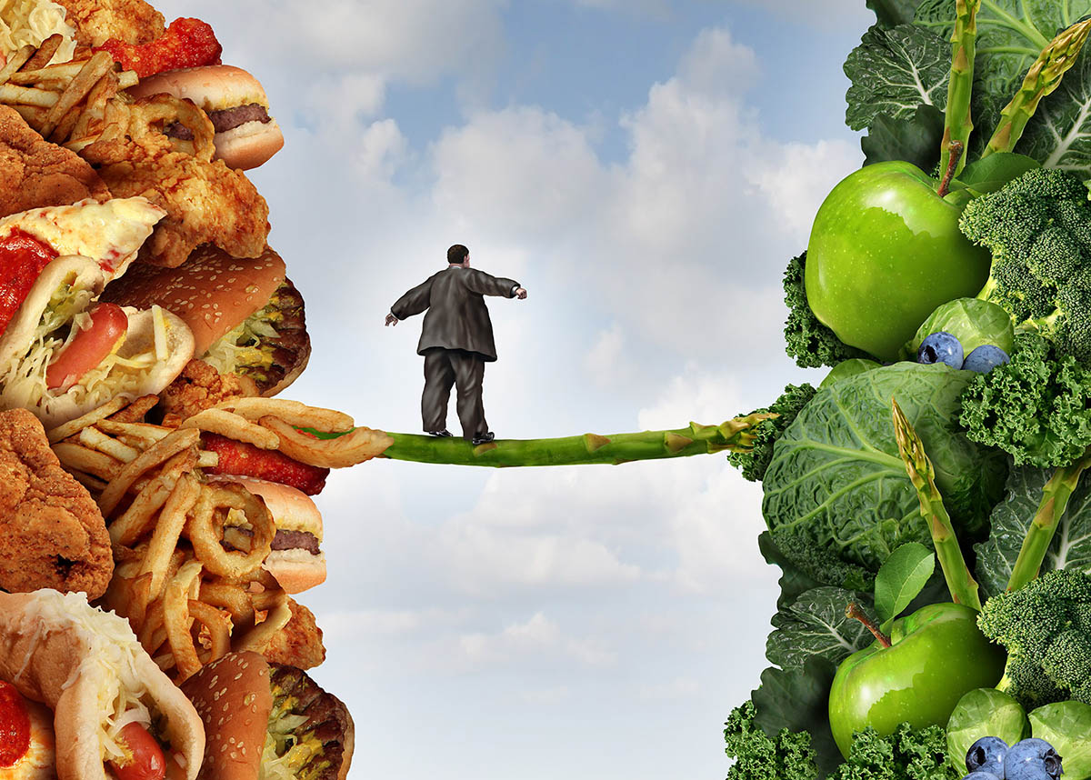 image of a man on a high wire between junk food and healthy food