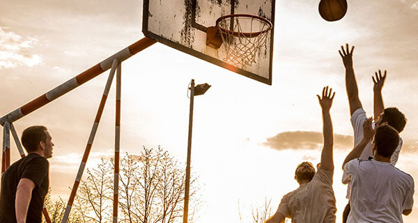 image of a group of men playing basketball