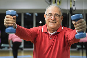 image of older man with barbells