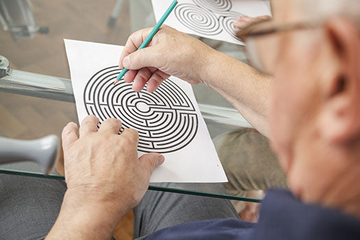 image of older man stimulating his brain with cognitive activities