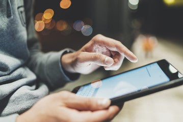 image of teen using tablet computer