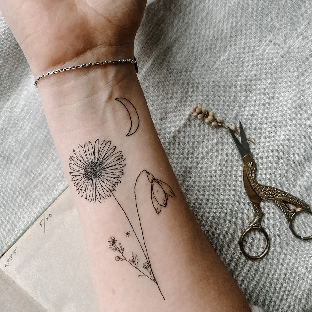 april month flower tattoo