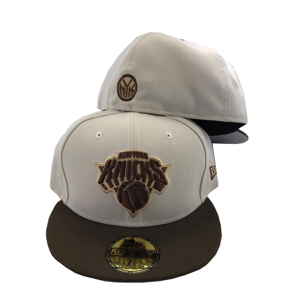 brown and white fitted cap