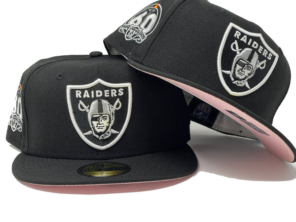 black and pink raiders hat