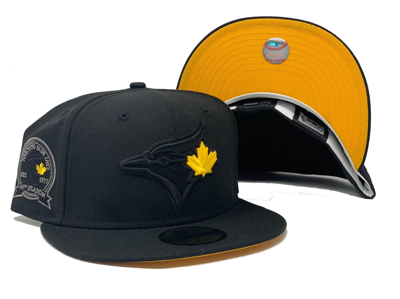 black blue jays hat with red maple leaf