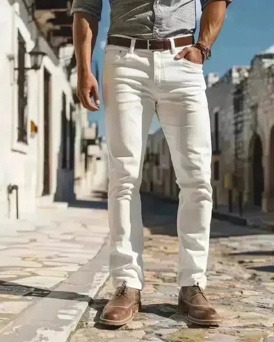 Man in white stretch jeans at the Alamo, Texas, embodying modern comfort and style. Spring season.