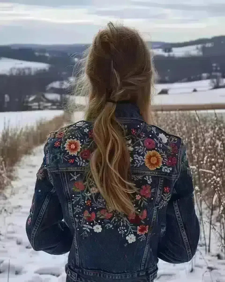 Woman in detailed embroidered denim jacket, Pennsylvania countryside background. Late Winter  season.