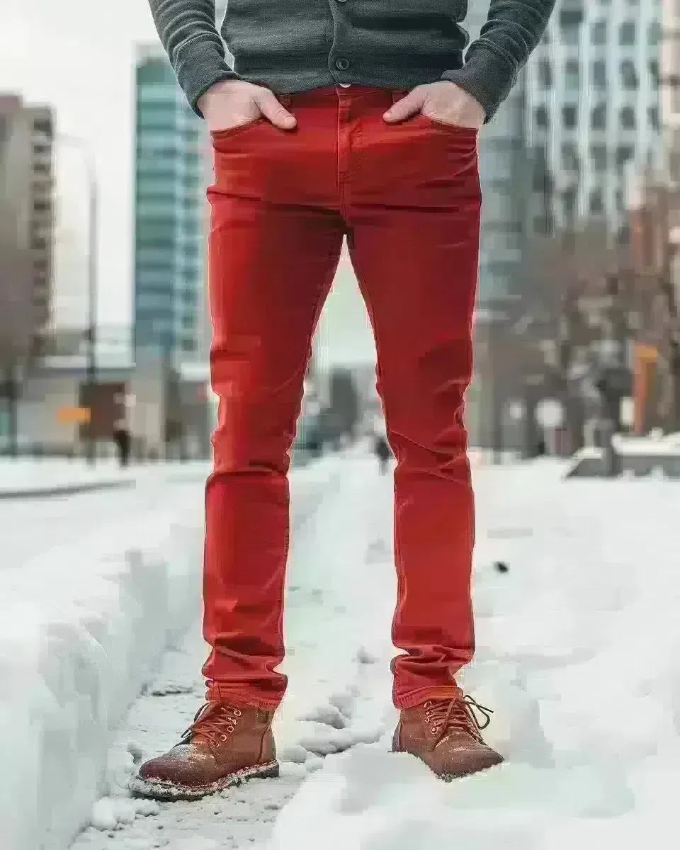 Men's red denim pants, tailored fit, vibrant, outdoor city background. Winter  season.