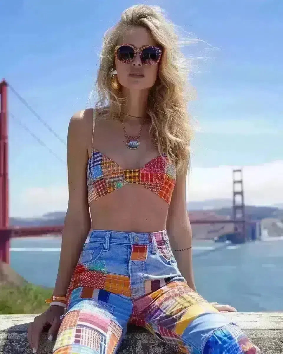 Confident woman in colorful patchwork jeans at Golden Gate Bridge. Spring season.