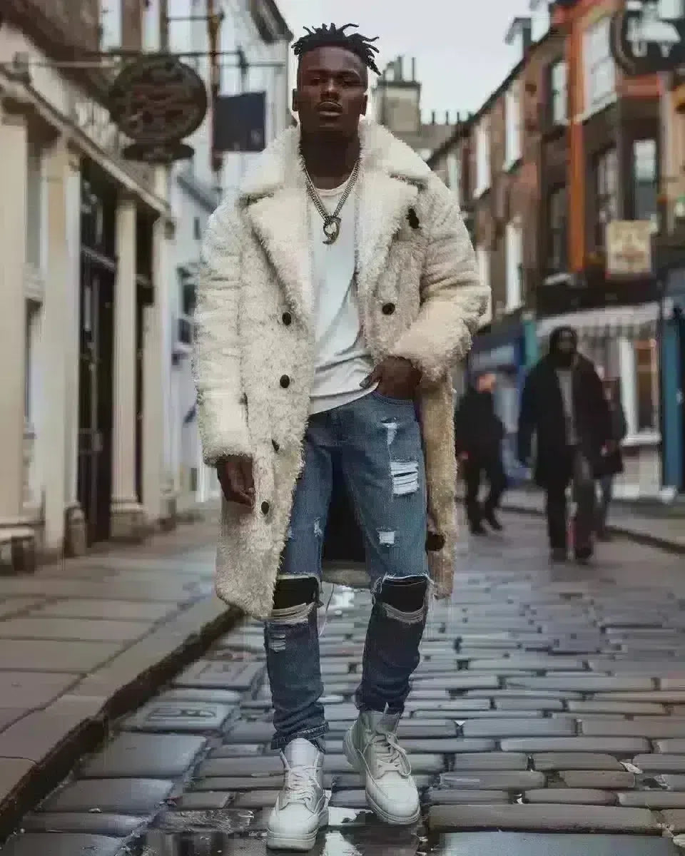 Diverse male model in Yorkshire street, showcasing blue ripped jeans full height. Spring season.