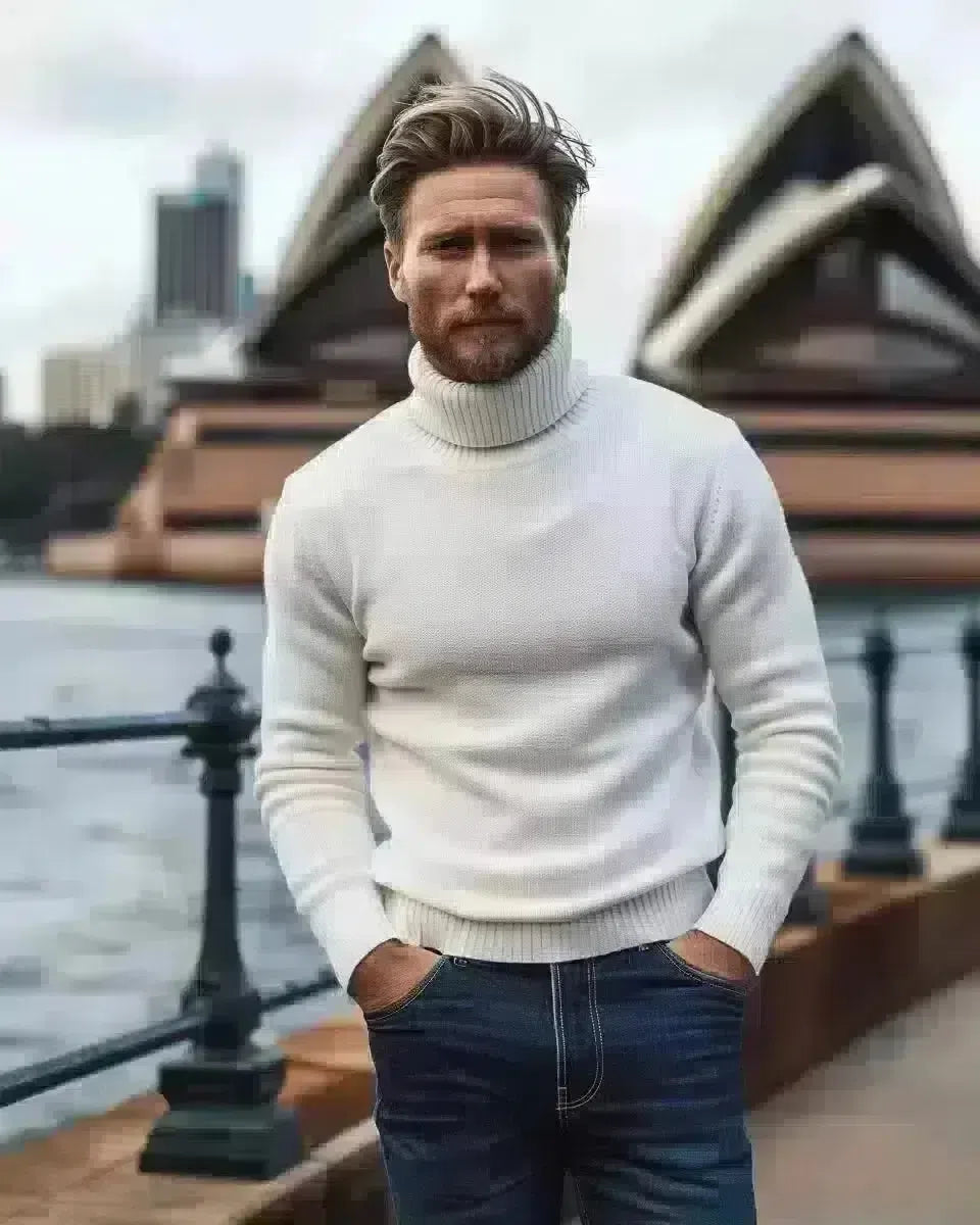 Diverse man in indigo high-waisted jeans, white turtleneck by Sydney Opera House. Spring season.