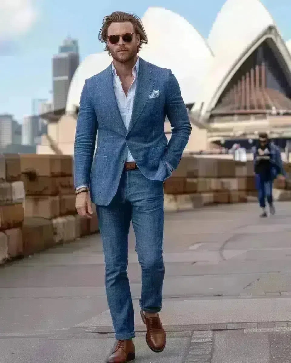 Sophisticated man in indigo selvedge jeans at Sydney Opera House. Spring season.