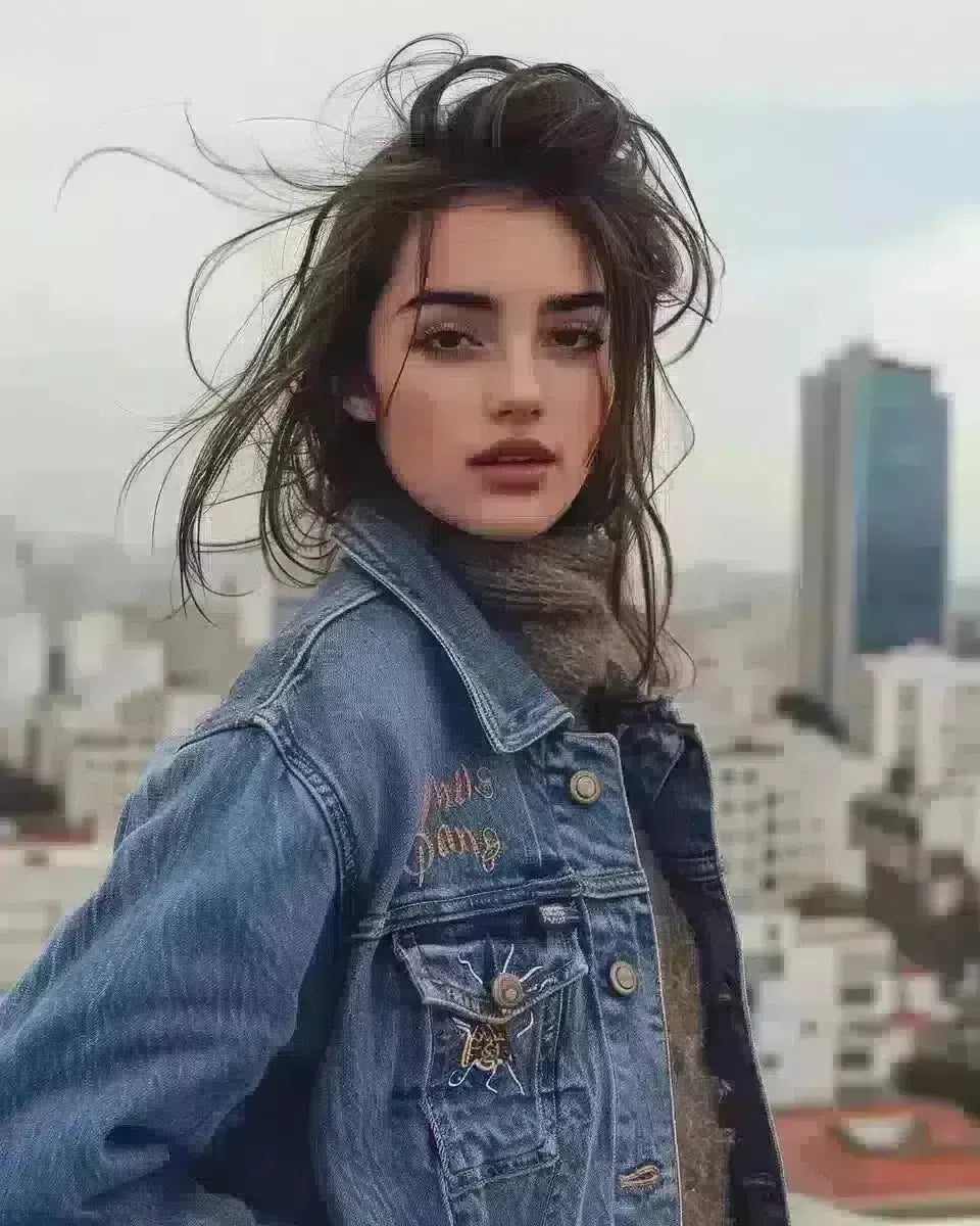 Woman in denim jacket, Disney embroidery, city backdrop. Late Winter  season.