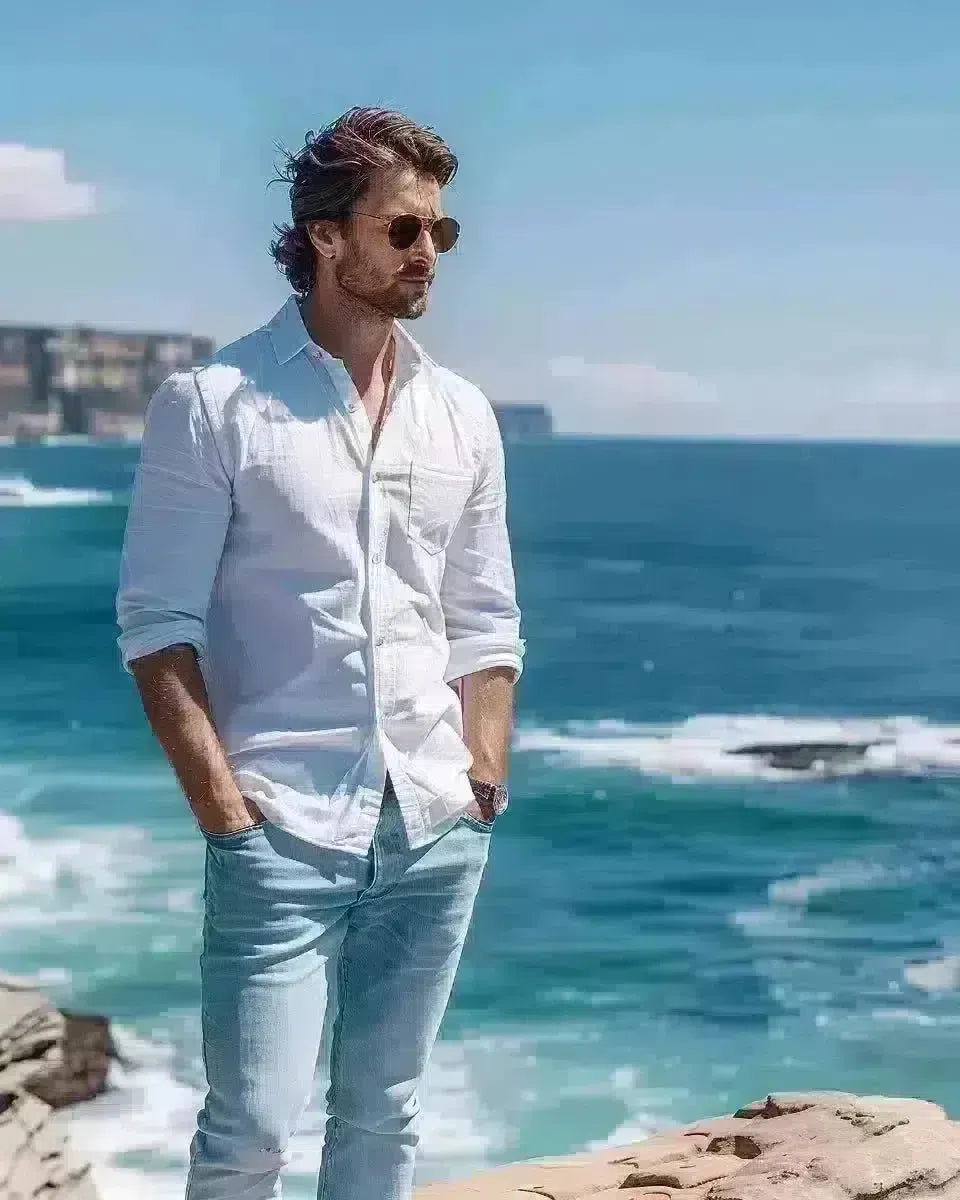 Casual men's jeans, mid-blue, relaxed style, Bondi Beach backdrop, Australian ambiance. Spring season.