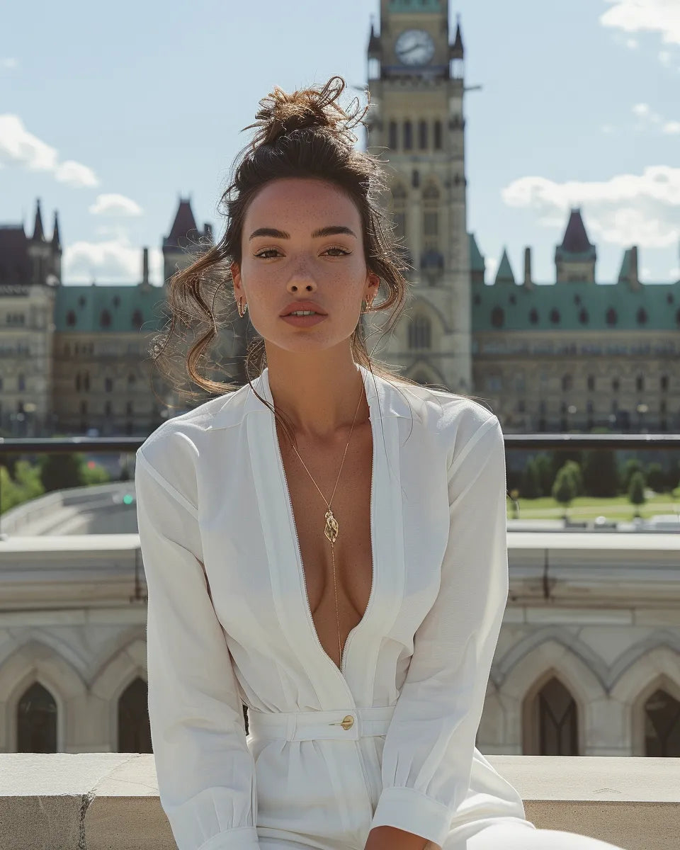Fashion-forward woman in white denim jumpsuit with tailored fit, zipper front, and cinched waist; sporty and chic. Summer season. Latino female. Parliament Hill, Ottawa, Ontario city background.