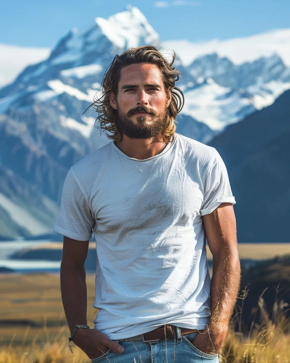 Men's high-waisted jeans, vintage-inspired, flattering fit, elongated legs, cinched waist, perfect for modern fashion look. Summer season. White male. Aoraki/Mount Cook National Park, Canterbury city background.