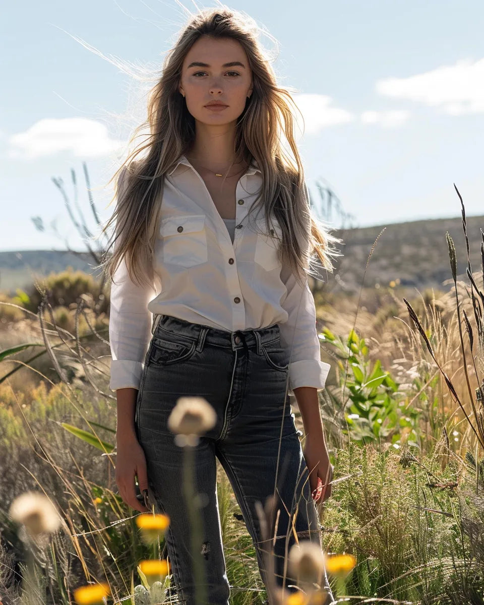 Explore versatile women's grey jeans showcasing low-waist to high-waist styles, from slim to flared fits, for all body types. Autumn season. White female. Kangaroo Island, South Australia background.