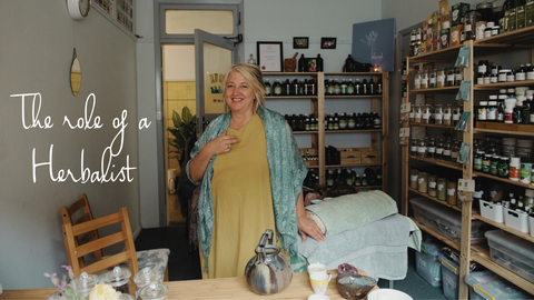 Fiona Gray Herbalist in her clinic surrounded by the herbal medicines she uses in her practice.